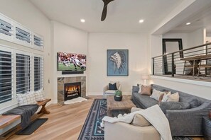 Settle in by the fire after a day on the mountain! Great room features living room, kitchen and dining area