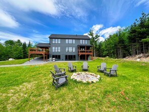 Outdoor fire pit with cozy Adirondack chairs