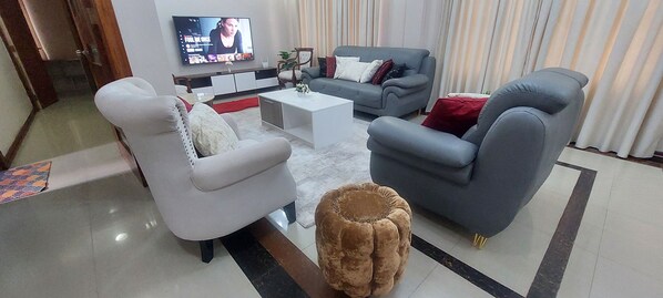 Spacious living room with streaming services, internet and air conditioner