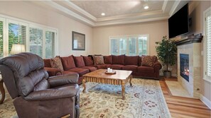 View the 65" TV and fireplace from the comfort of the leather recliner or sofa.