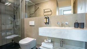 Step into modernity with a refreshing shower and premium amenities. Your daily escape awaits!  #BathroomBliss #LovelyStay
