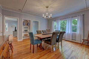 The beautifully decorated dining room can accommodate extra people. 