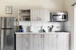 Modern Kitchen of the Apartment in Noord Aruba - Fully Equipped Modern kitchen with sleek, stainless-steel appliances - Smart use of space with versatile storage solutions - Fully Equipped