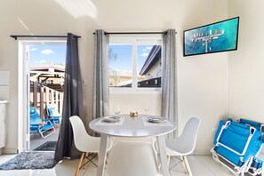 Elegant Dining Area of the Apartment in Noord Aruba -  2 Persons Dining - Smart TV and Netflix - Artfully arranged table settings for a touch of elegance - Access to outdoors - Beautifully crafted dining table