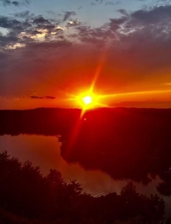 Watch the sunset on Lake Catherine from balcony