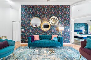 A living room that pops with a vividly patterned feature wall