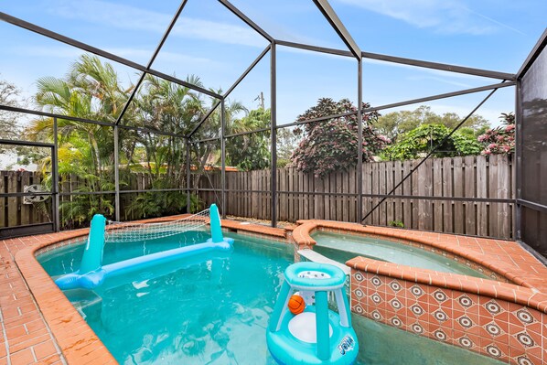 An inviting backyard oasis featuring a sparkling pool