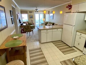 Fully stocked Kitchen with large island opens up to Living Room