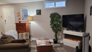 View of living area from bed. A lovely, cozy space. You park in front of suite.