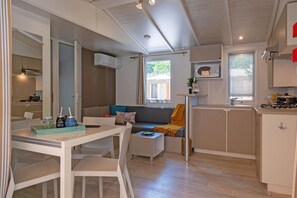 Experience open-plan living with a spacious and bright dining and kitchen area, perfect for family meals and socializing.