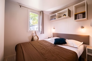 Elegant bedroom with minimalist decor, providing a serene and relaxing space for guests.