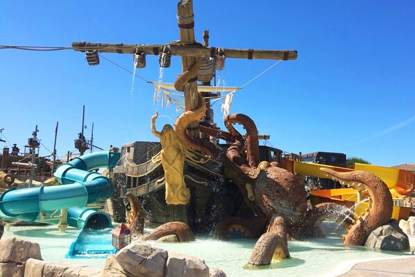 Pirate-themed water playground with slides and splash features, perfect for adventurous kids.