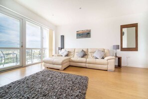 Lounging area with large patio doors with far reaching views