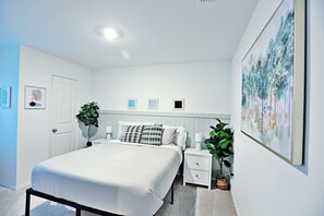 Room 2 with queen bed and dedicated office space