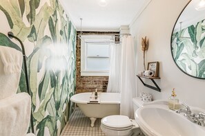 Bathroom 2 features a clawfoot tub.