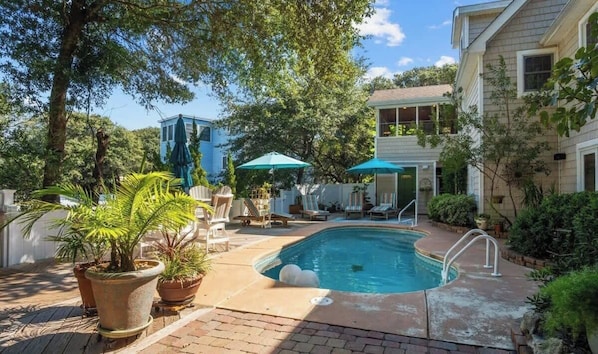 Dive into paradise in your own private oasis! Enjoy the serene ambiance of this fenced pool surrounded by lush landscaping. Your ultimate relaxation spot awaits! #PoolParadise #LushLandscaping #Staycation
