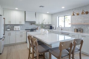 Kitchen includes a nespresso machine, air fryer, blender & also traditional coffee maker.