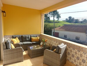 Upstairs Terrace with sofa set and reclining loungers