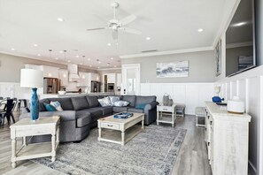 The ocean front living room is well-appointed with comfortable furnishings.