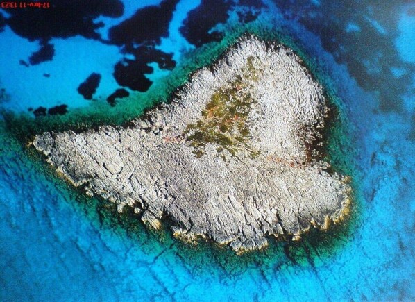 Heart-shaped island opposite Methoni, you can snorkel round