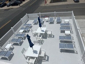 Sundeck with lounge chairs and picnic tables