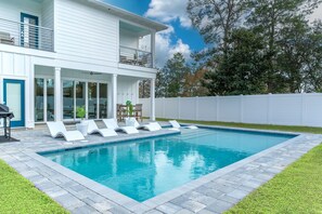 Enjoy Ovation's fenced, private backyard grill and pool area! 