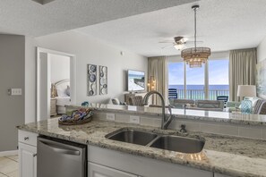 Kitchen has GULF VIEWS, granite countertops, stainless appliances - fully stocked with more than the basics (coffee/tea bar, oils/salt and pepper, Tupperware, plenty of pots/pans/cookware)