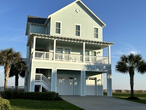 Beach front home with plenty of space to park on the driveway.