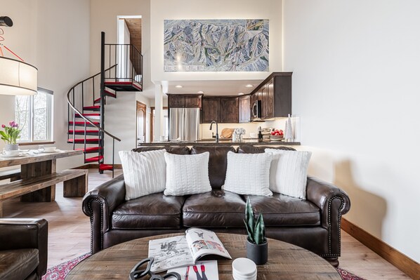 Living Area with Gas Fireplace, Leather Sofa, and Smart TV
