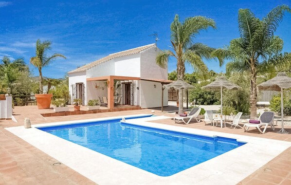The villa and pool area