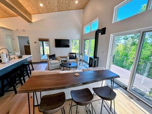 Enjoy meals at the high-top table or the kitchen island with additional seating for three.