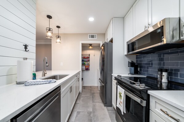 Beautiful kitchen featuring shiplap and stainless steel appliances