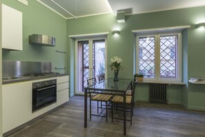 Living room with kitchen and access to the terrace