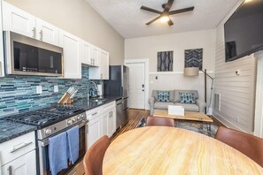 Large living and dining area with renovated kitchen
