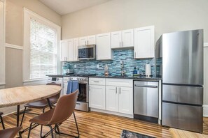 Large living and dining area with renovated kitchen