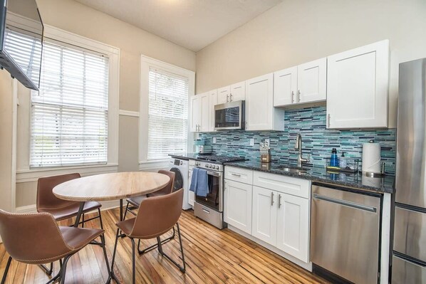Large living and dining area with renovated kitchen