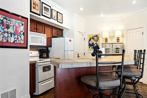 Enjoy an eat-in kitchen, perfectly situated to prepare all of your basic meals and snacks.