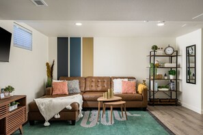 The plush couch invites relaxation, creating a cozy haven for your moments.