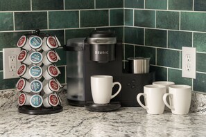 Elevate your mornings in our kitchen, featuring a Keurig coffee machine.
