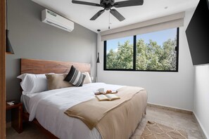 Experience the perfect blend of comfort and entertainment in our wood-themed bedroom with a king-size bed and a TV – your ultimate retreat