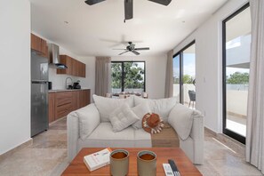 Unwind in style in our chic minimalist living room, where clean lines and simplicity create a calming atmosphere