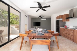 Create lasting memories in our home's heart – the wood-themed dining area and kitchen seamlessly connected across the inviting living room and scenic balcony