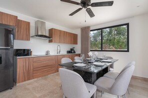 Cook, dine, and connect in our spacious open concept kitchen and dining aread dining area