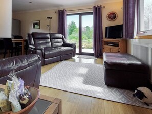 Living area with recliner leather chairs | Roe Deer Cottage, North Ballachulish, near Glencoe