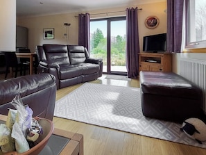 Living area with recliner leather chairs | Roe Deer Cottage, North Ballachulish, near Glencoe