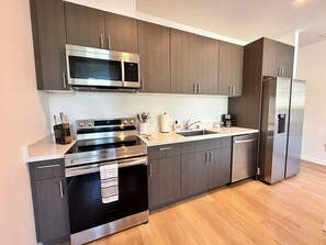 full kitchen with all dishes, utensils and cooking ware