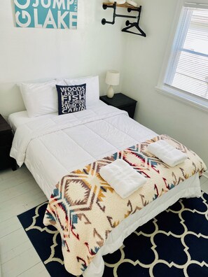 Bedroom 1 - quality Queen mattresses and white linens