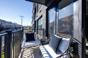 Unit 1: Private outdoor patio with outdoor seating.