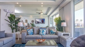 Two sofas and a large wall mirror in the living room.