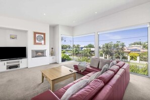 With ocean vistas to the east, watch ships sail the horizon from your living room